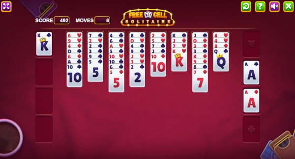 Screenshot of the FreeCell Solitaire game on PrimeCardGames.com, featuring a colorful game board with playing cards neatly arranged.